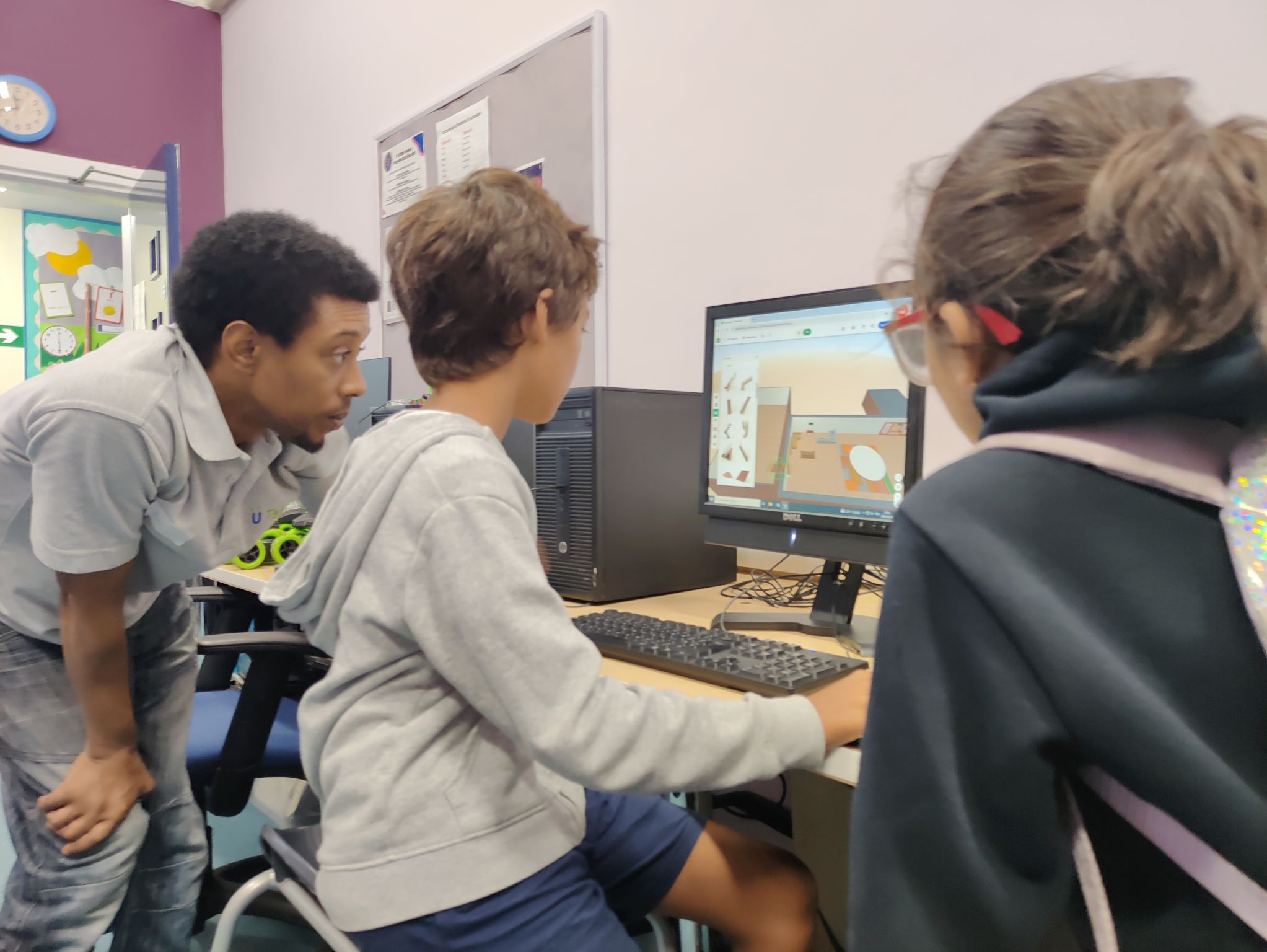 Teacher helping a student with their 3D design project